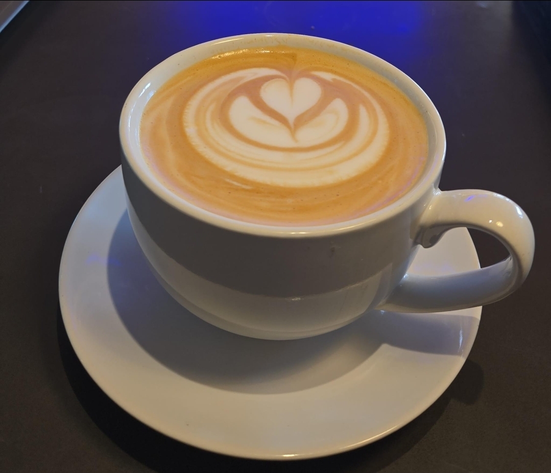 Pour-over coffee being brewed with a gooseneck kettle